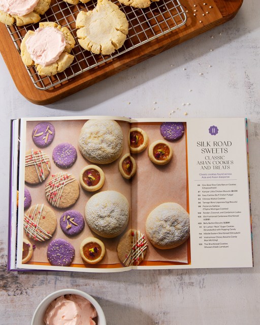 Picture of 108 Asian Cookies open to a page showing a variety of colorful cookies next to the heading "Silk Road Sweets"